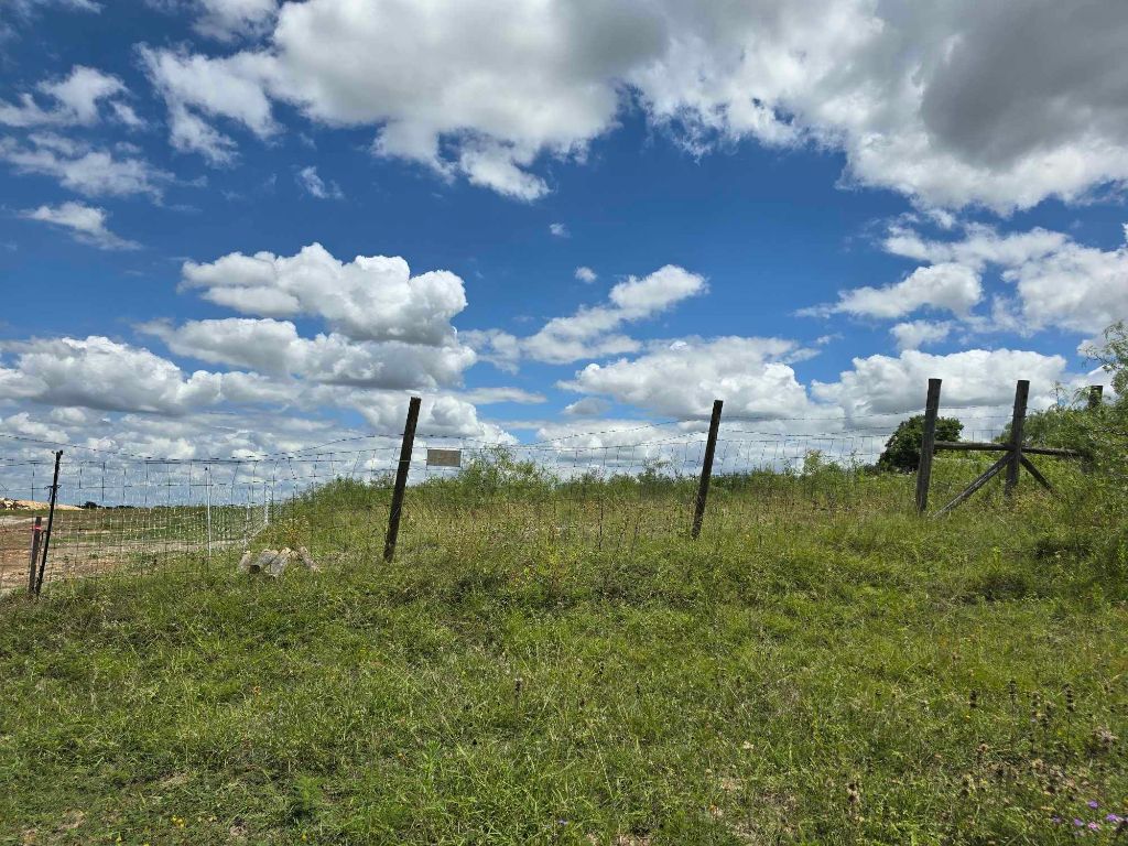 414 3 G Ranch Road Kyle, TX 78640 - Photo 2 of 4 a view of a golf course with a fountain