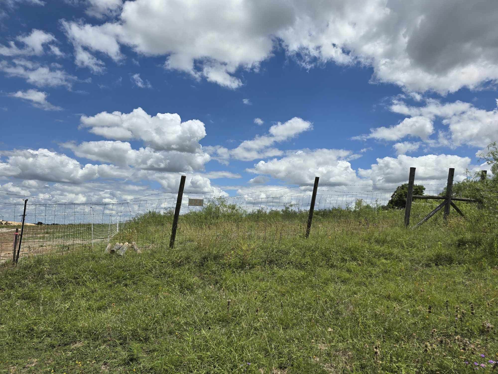 414 3 G Ranch Road Kyle, TX 78640 - Photo 2 of 4 a view of a golf course with a fountain