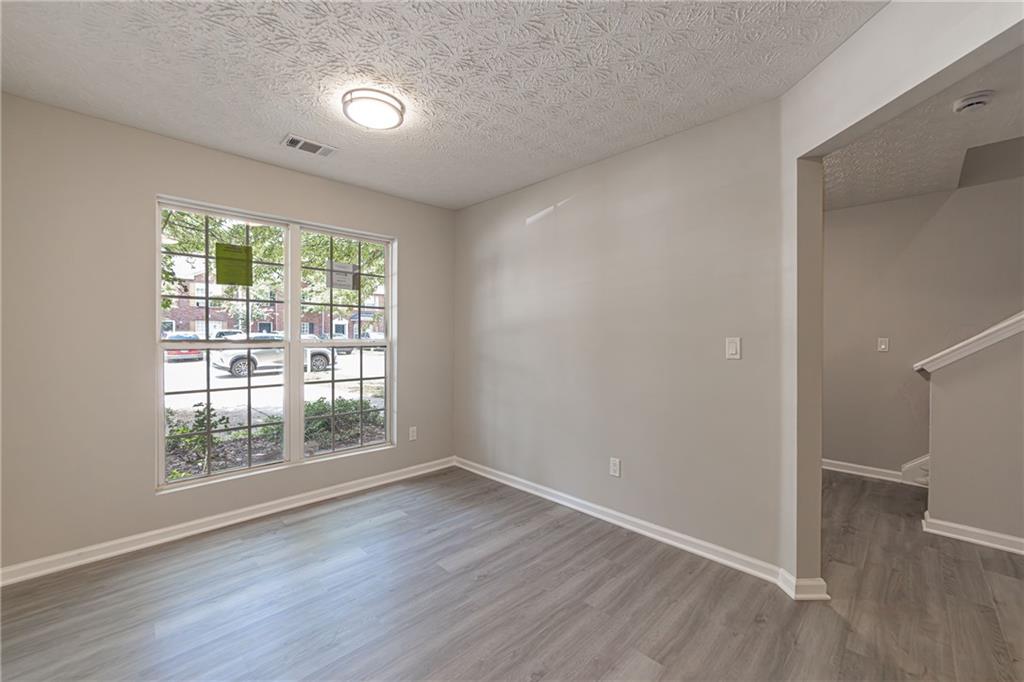 3017 Waldrop Circle Decatur, GA 30034 - Photo 12 of 52 wooden floor in an empty room with a window