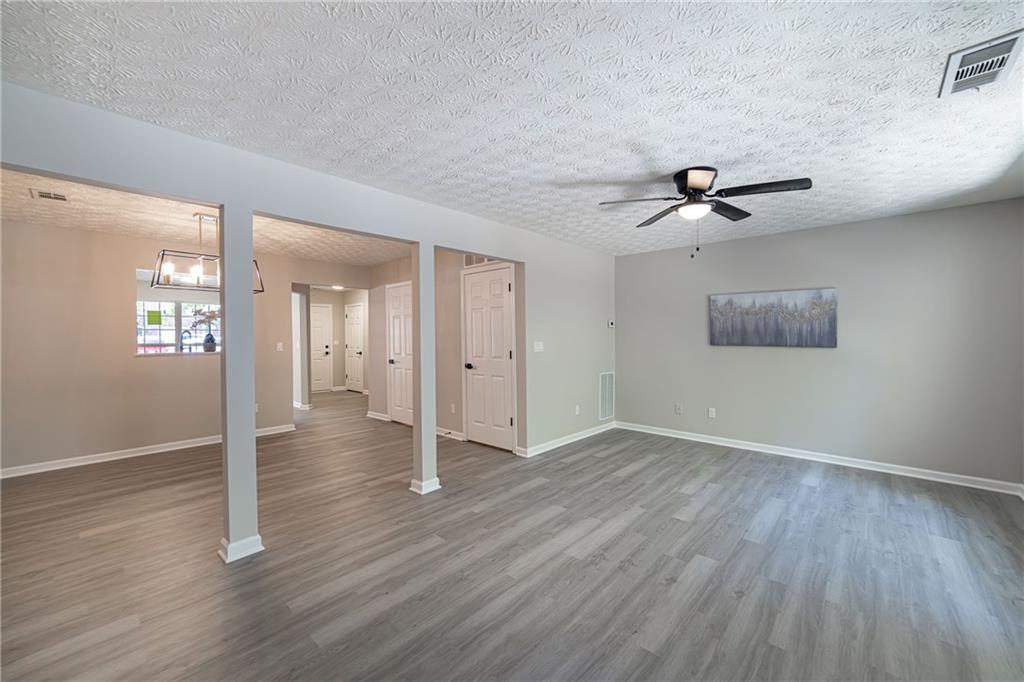 3017 Waldrop Circle Decatur, GA 30034 - Photo 15 of 52 wooden floor in an empty room with a window