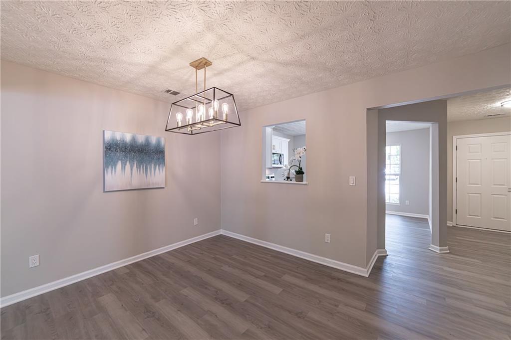 3017 Waldrop Circle Decatur, GA 30034 - Photo 17 of 52 wooden floor in an empty room with a window