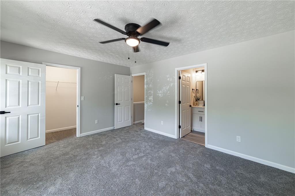 3017 Waldrop Circle Decatur, GA 30034 - Photo 33 of 52 an empty room with closet and a ceiling fan