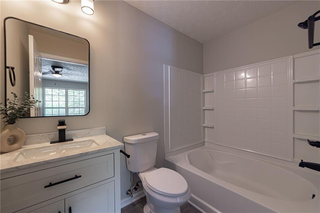 3017 Waldrop Circle Decatur, GA 30034 - Photo 36 of 52 a bathroom with a sink a toilet and shower
