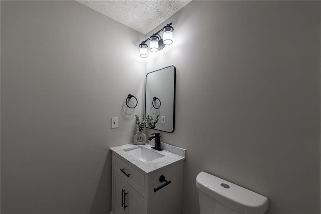 3017 Waldrop Circle Decatur, GA 30034 - Photo 37 of 52 a bathroom with a toilet sink and mirror