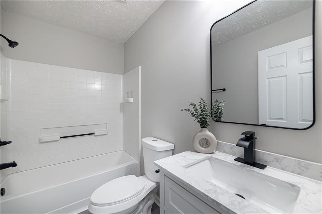 3017 Waldrop Circle Decatur, GA 30034 - Photo 38 of 52 a bathroom with a sink a toilet and shower