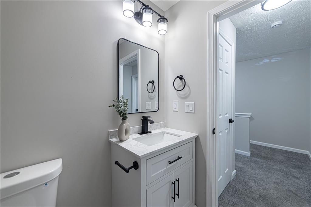 3017 Waldrop Circle Decatur, GA 30034 - Photo 40 of 52 a bathroom with a sink a toilet and a mirror
