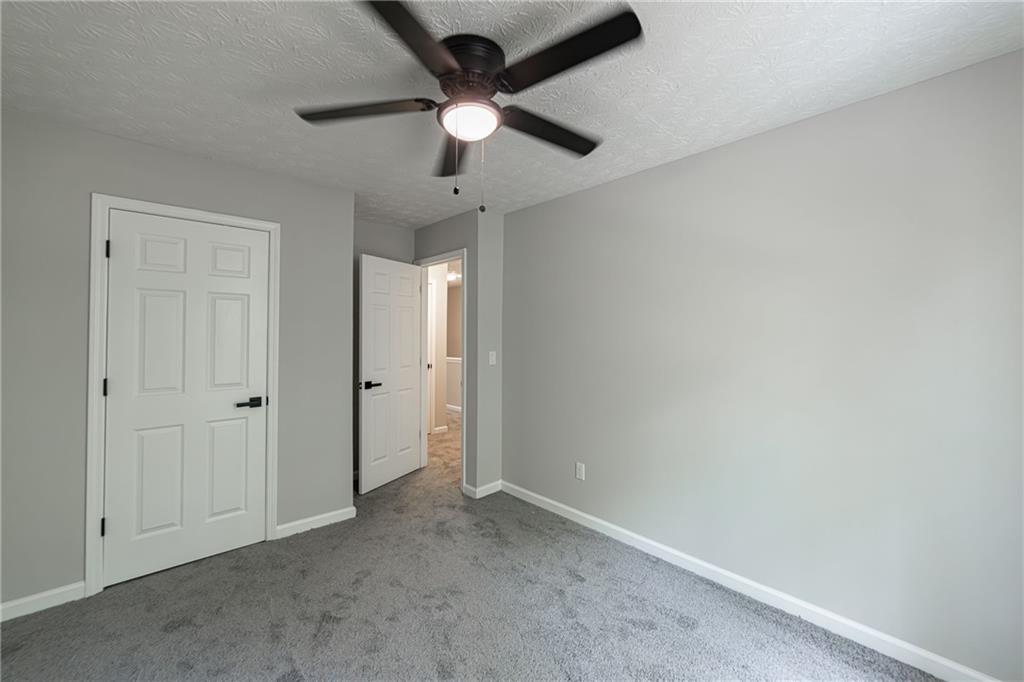 3017 Waldrop Circle Decatur, GA 30034 - Photo 42 of 52 an empty room with chandelier fan