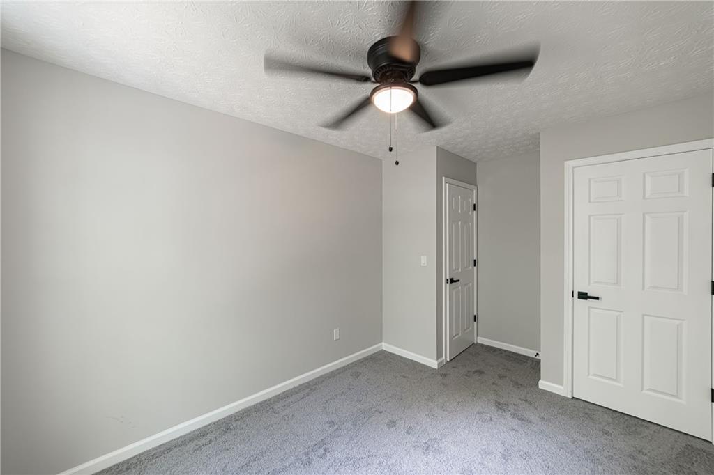 3017 Waldrop Circle Decatur, GA 30034 - Photo 46 of 52 an empty room with a ceiling fan