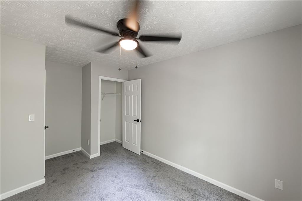 3017 Waldrop Circle Decatur, GA 30034 - Photo 48 of 52 an empty room with a ceiling fan and a window