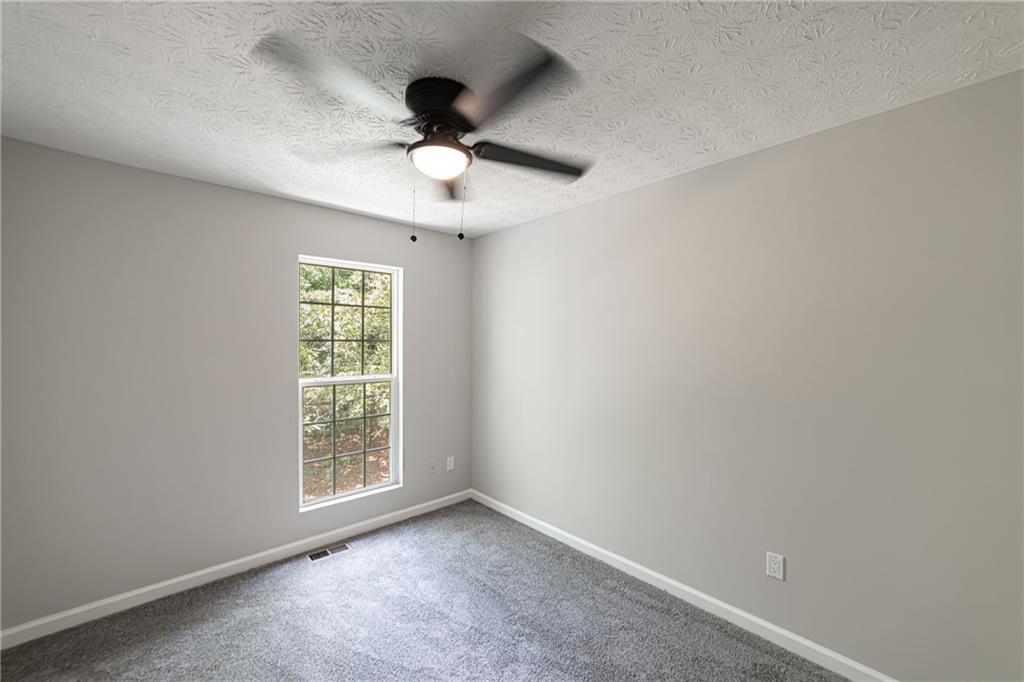 3017 Waldrop Circle Decatur, GA 30034 - Photo 49 of 52 an empty room with a window and a fan