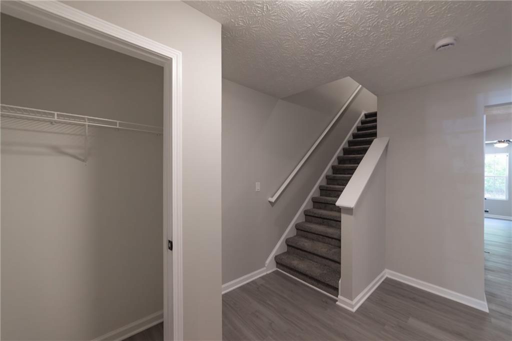 3017 Waldrop Circle Decatur, GA 30034 - Photo 6 of 52 a view of an empty room with wooden floor and stairs