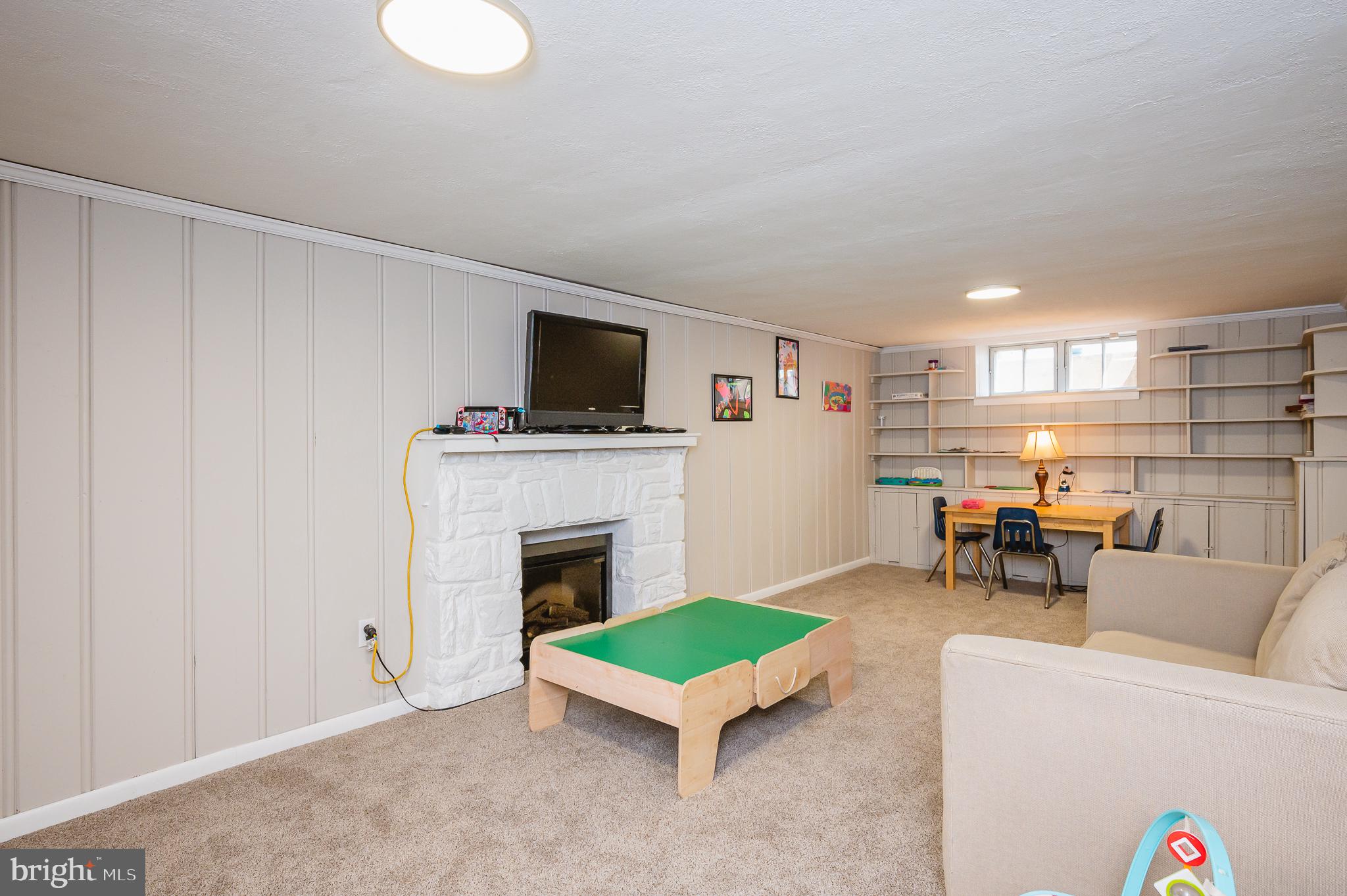 7025 Kenleigh Road Baltimore, MD 21212 - Photo 43 of 53 Lower level with decorative fireplace.