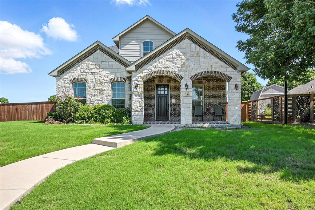 7514 Harbor Drive Rowlett, TX 75088 - Photo 1 of 1 French country style house featuring stone siding and covered porch