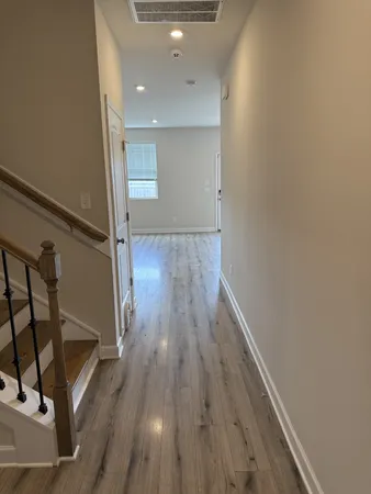 a view of kitchen with kitchen island microwave and stove