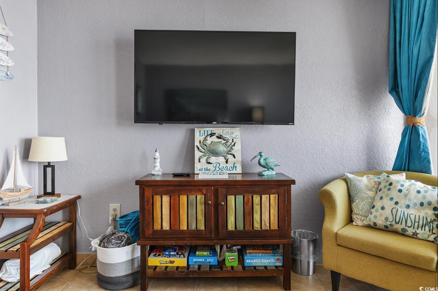 201 74th Avenue North, Unit 2527 Myrtle Beach, SC 29572 - Photo 13 of 18 Sitting room featuring tile patterned flooring and a textured wall