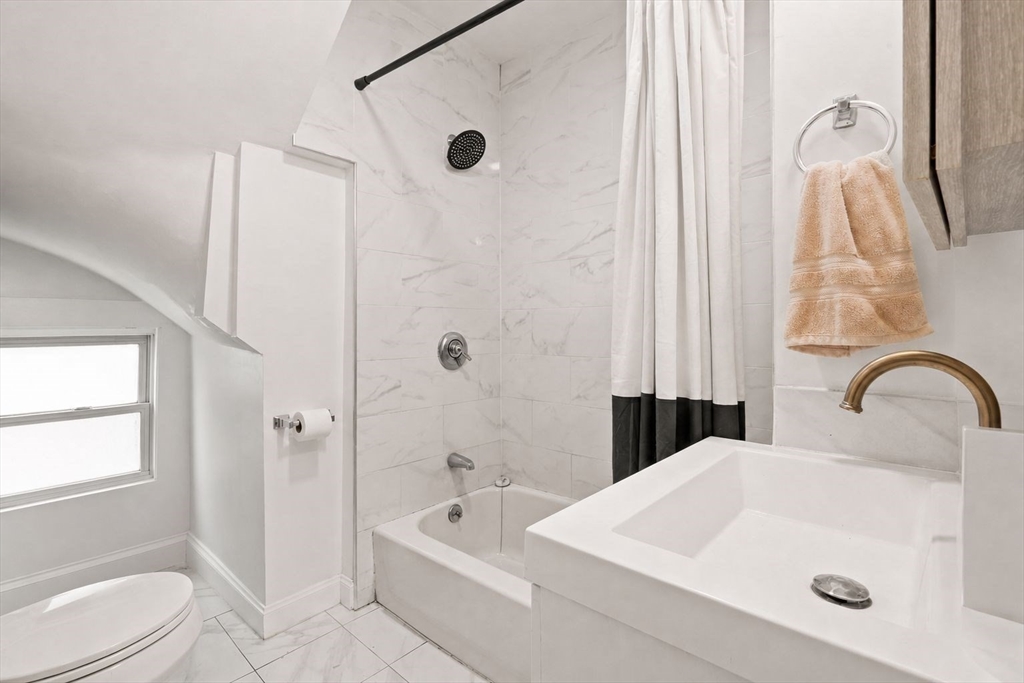 39 Union Street Boston, MA 02135 - Photo 15 of 33 a bathroom with a sink a toilet and a tub