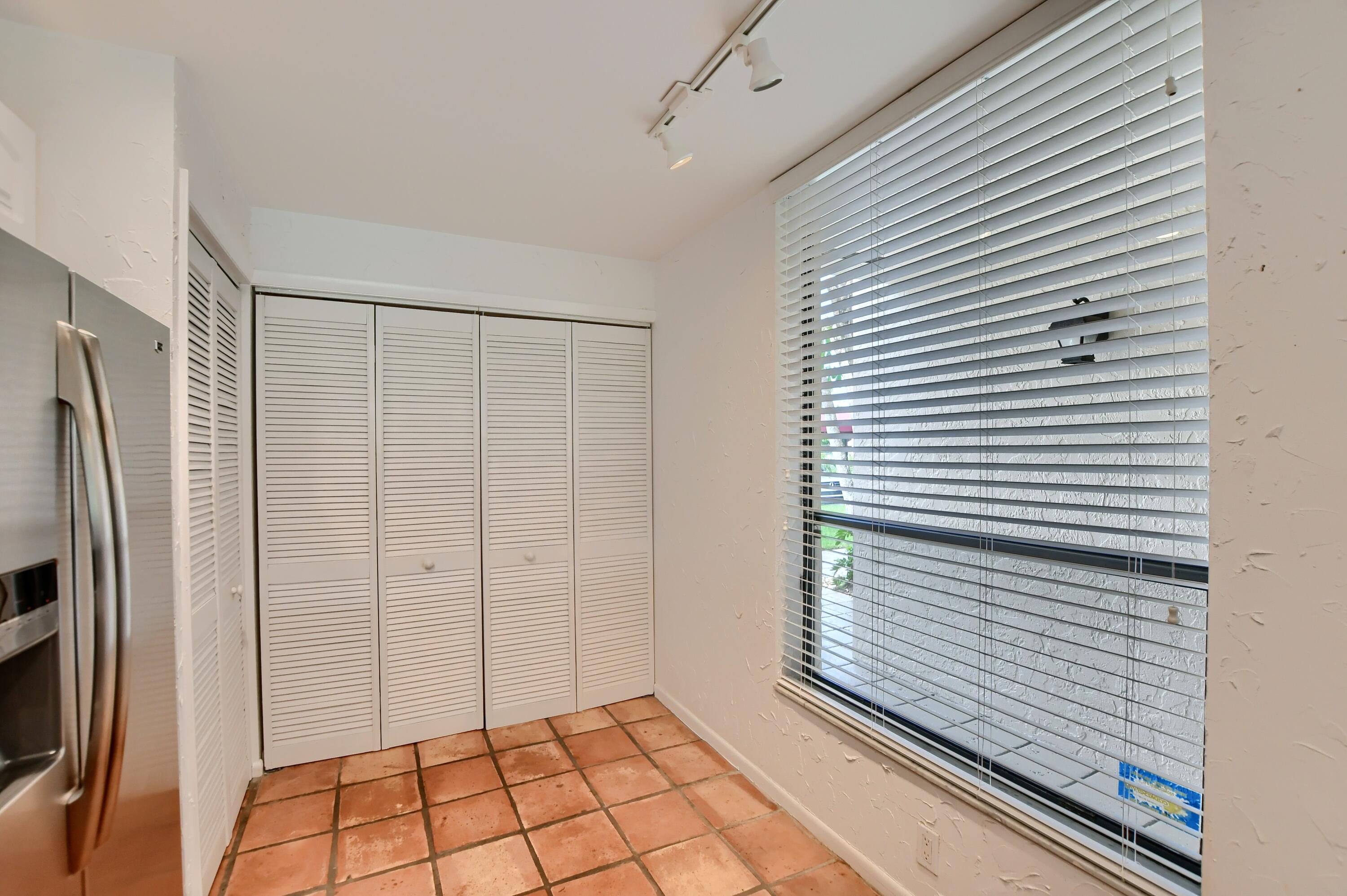 7495 La Paz Boulevard, Unit 105 Boca Raton, FL 33433 - Photo 13 of 29 a view of a utility room with a shower