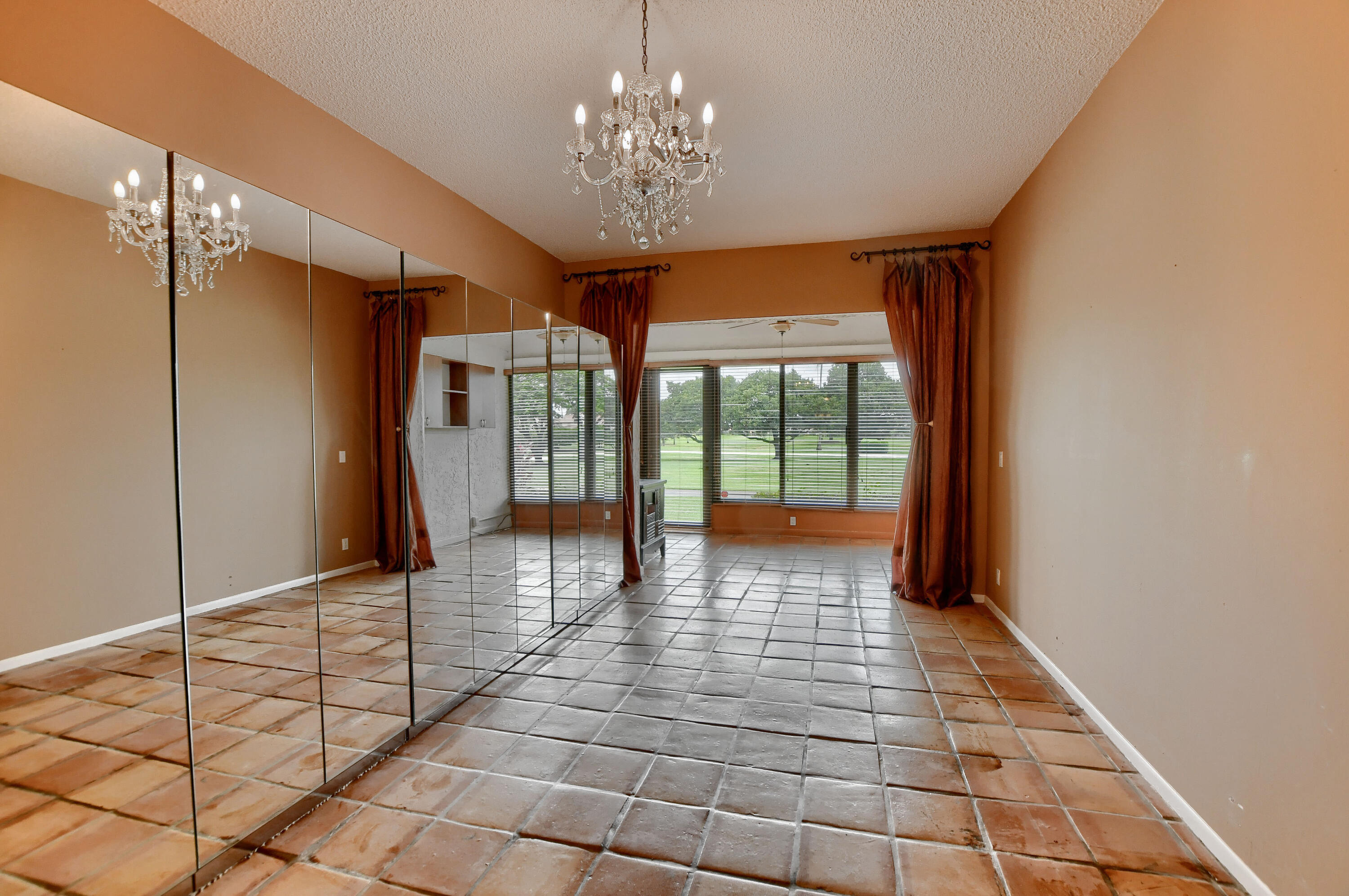 7495 La Paz Boulevard, Unit 105 Boca Raton, FL 33433 - Photo 18 of 29 a view of entryway with a floor to ceiling window and an entryway