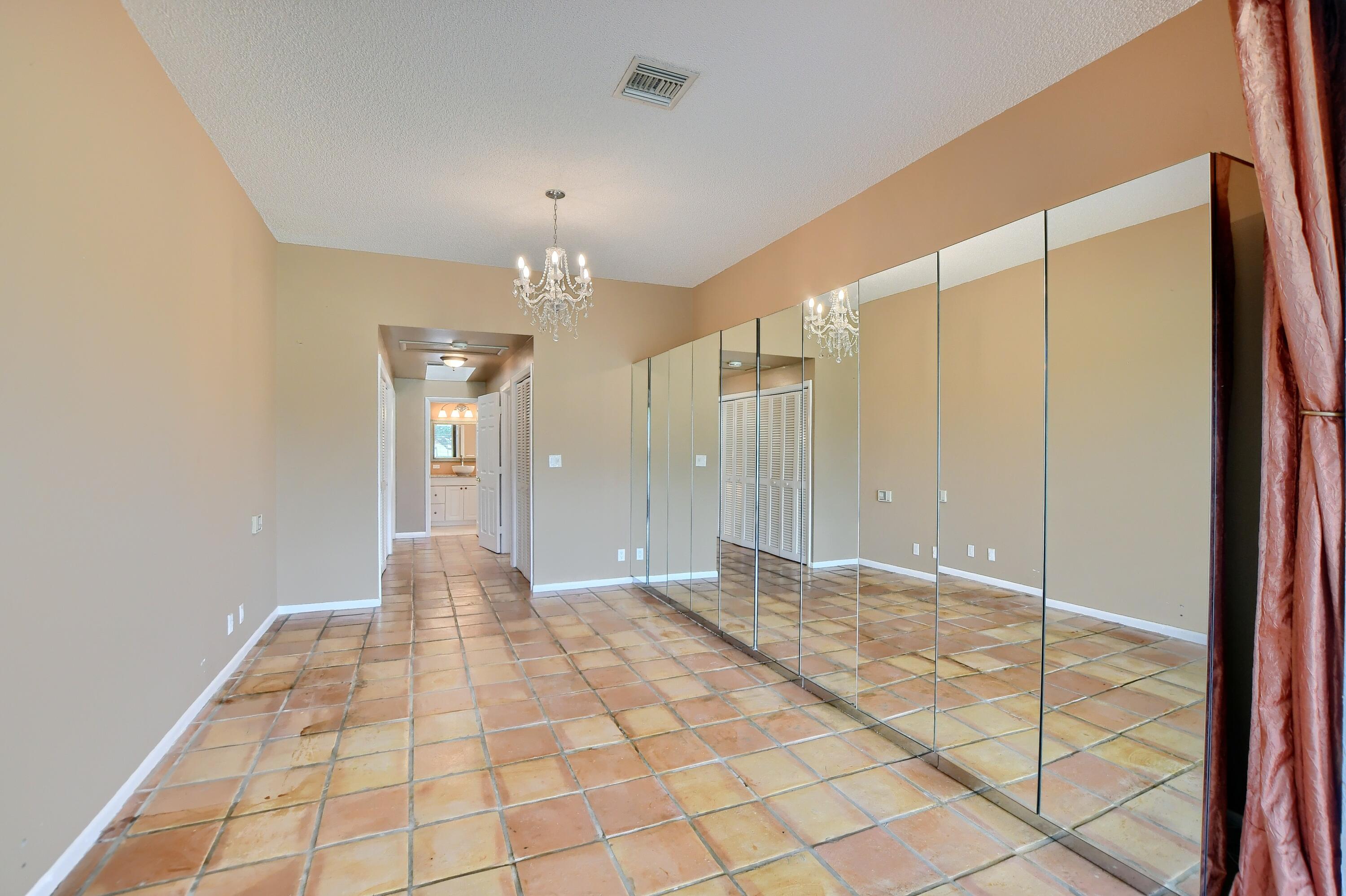 7495 La Paz Boulevard, Unit 105 Boca Raton, FL 33433 - Photo 20 of 29 a view of a bathroom with a shower