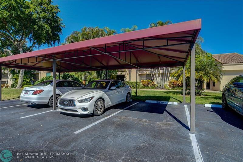 7495 La Paz Boulevard, Unit 105 Boca Raton, FL 33433 - Photo 28 of 29 a view of a car parked in garage