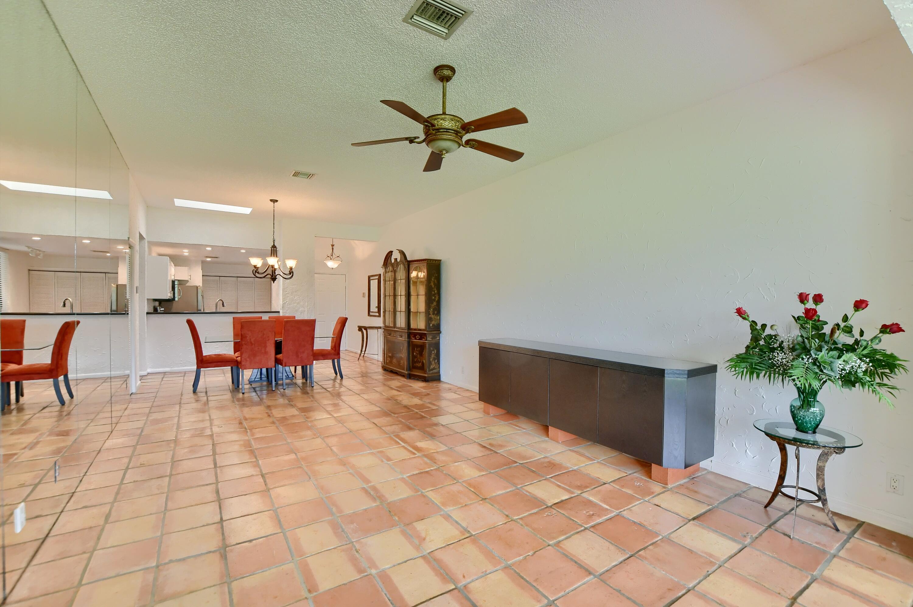 7495 La Paz Boulevard, Unit 105 Boca Raton, FL 33433 - Photo 8 of 29 a living room with furniture