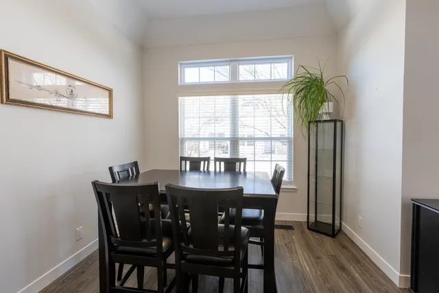 a view of a dining room with furniture and window