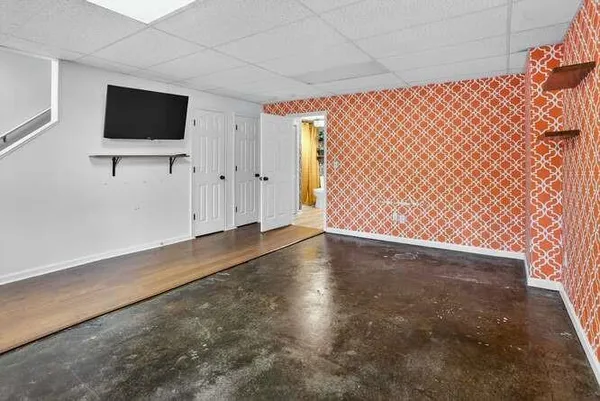 a bathroom with a toilet and a shower curtain