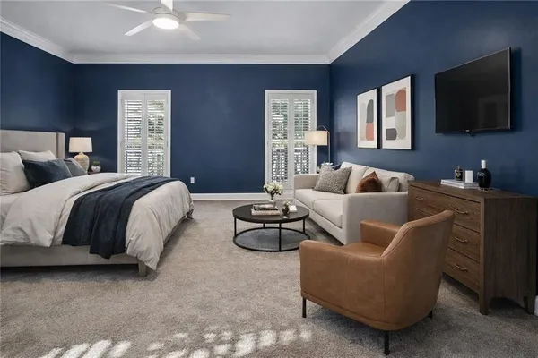 a bedroom with a large bed and a chandelier