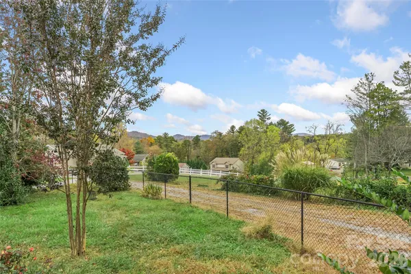 a view of a back yard from a patio