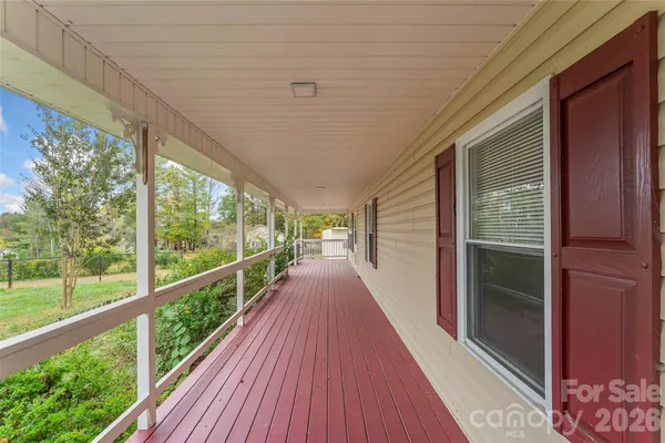 a view of balcony with wooden floor