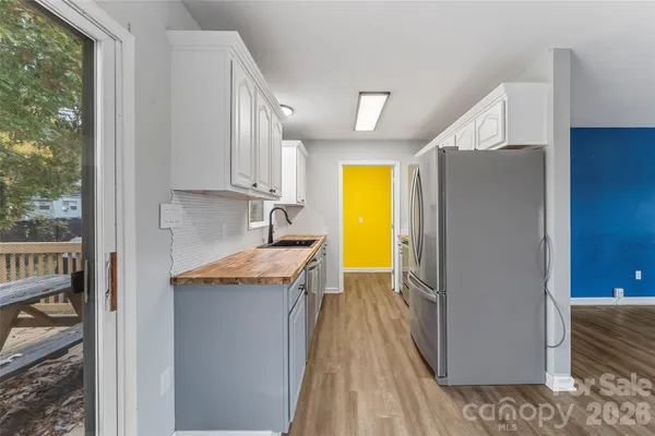 a kitchen with a sink and cabinets