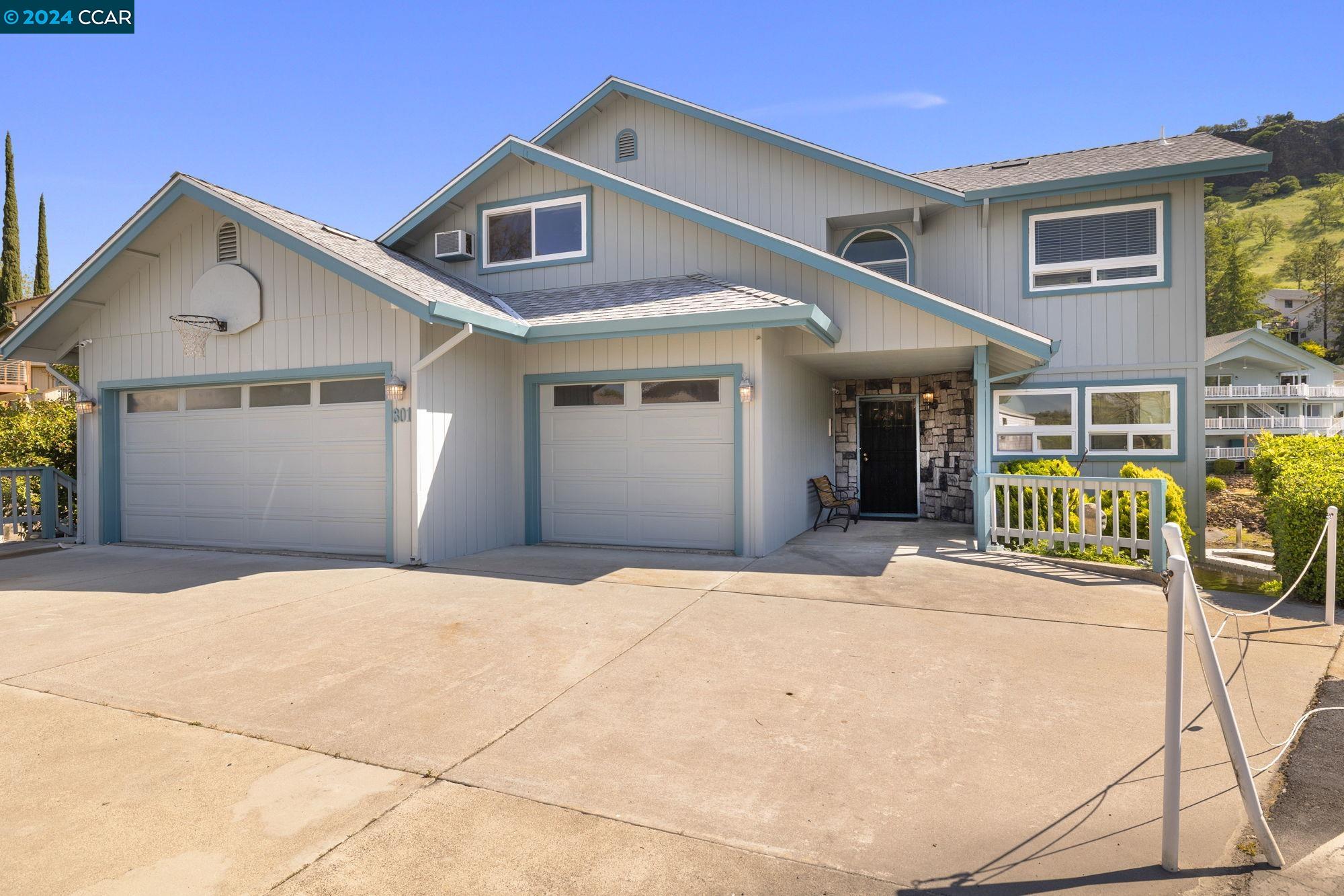 801 Mother Shipton Road Copperopolis, CA 95228 - Photo 1 of 1 a front view of a house with glass windows
