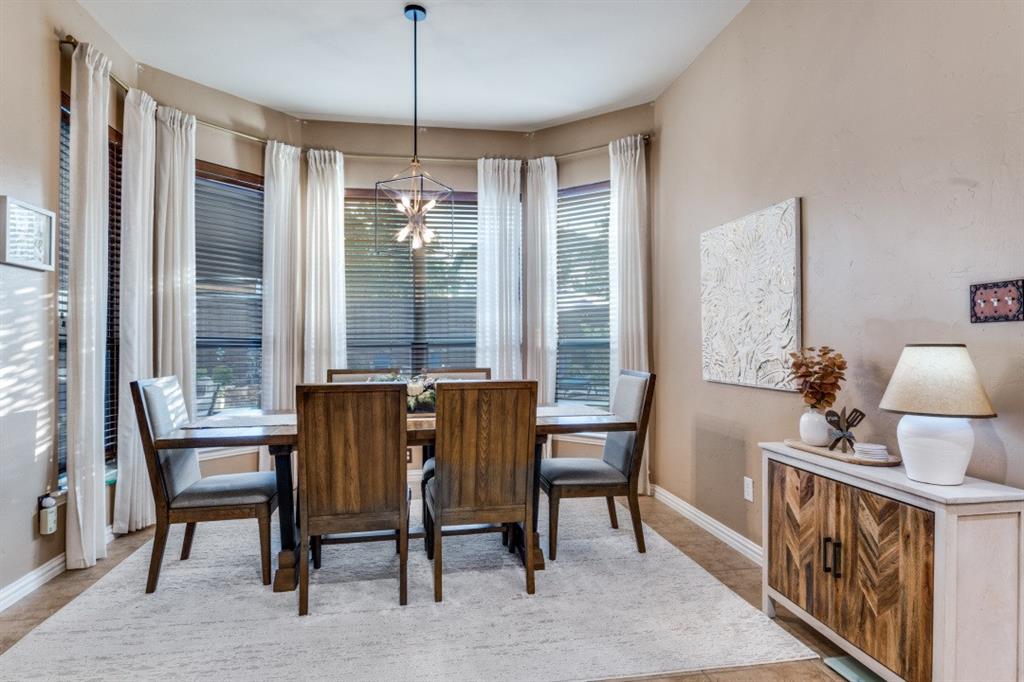 2810 Baker Street Sachse, TX 75048 - Photo 9 of 26 Dining area featuring baseboards and a chandelier
