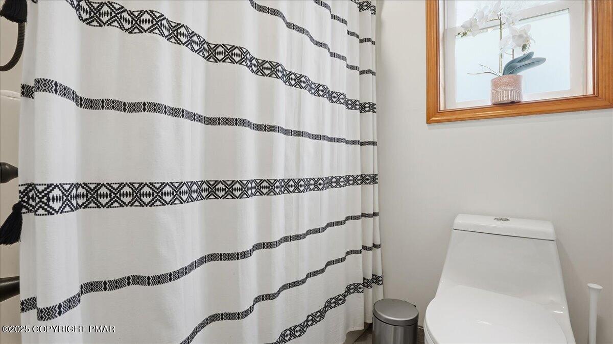 163 Long Woods Road Tobyhanna, PA 18466 - Photo 13 of 52 a bathroom with a toilet and a shower