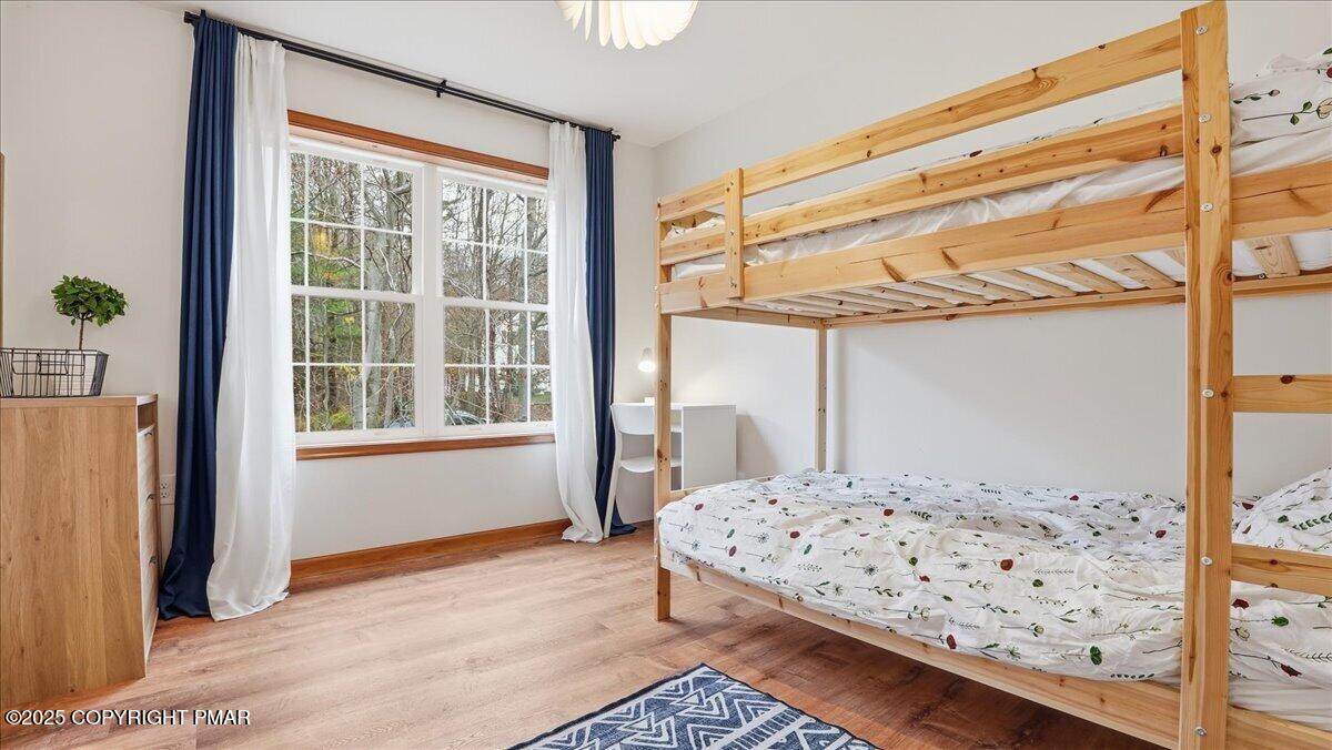 163 Long Woods Road Tobyhanna, PA 18466 - Photo 16 of 52 a bedroom with a bed and a window