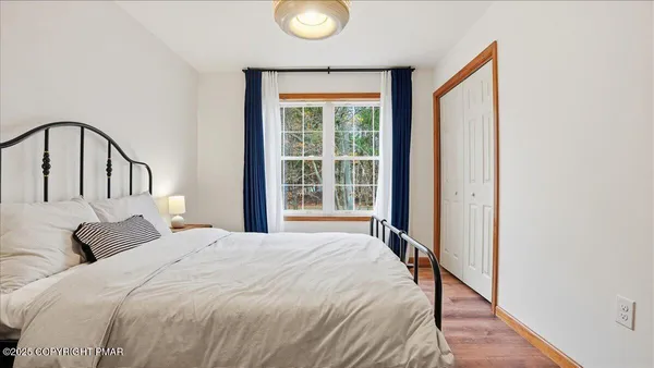 a bedroom with a bed and a tv in it