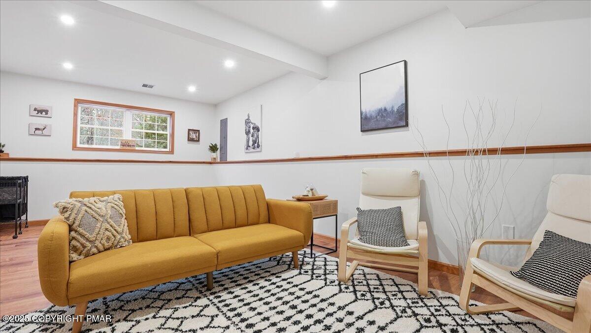 163 Long Woods Road Tobyhanna, PA 18466 - Photo 22 of 52 a living room with a couch and a dining table
