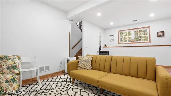 a living room with a couch and a flat screen tv