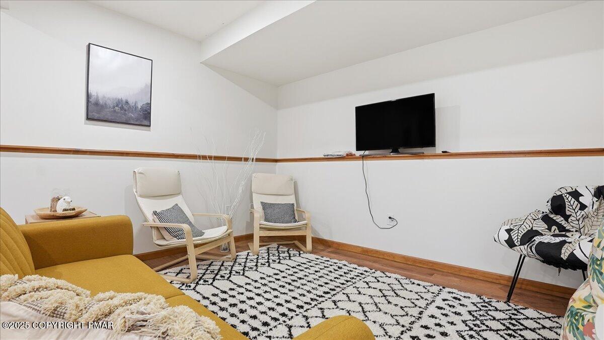 163 Long Woods Road Tobyhanna, PA 18466 - Photo 24 of 52 a living room with a couch and a flat screen tv