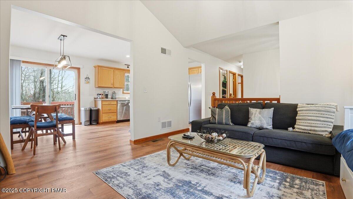163 Long Woods Road Tobyhanna, PA 18466 - Photo 25 of 52 a living room with furniture and wooden floor