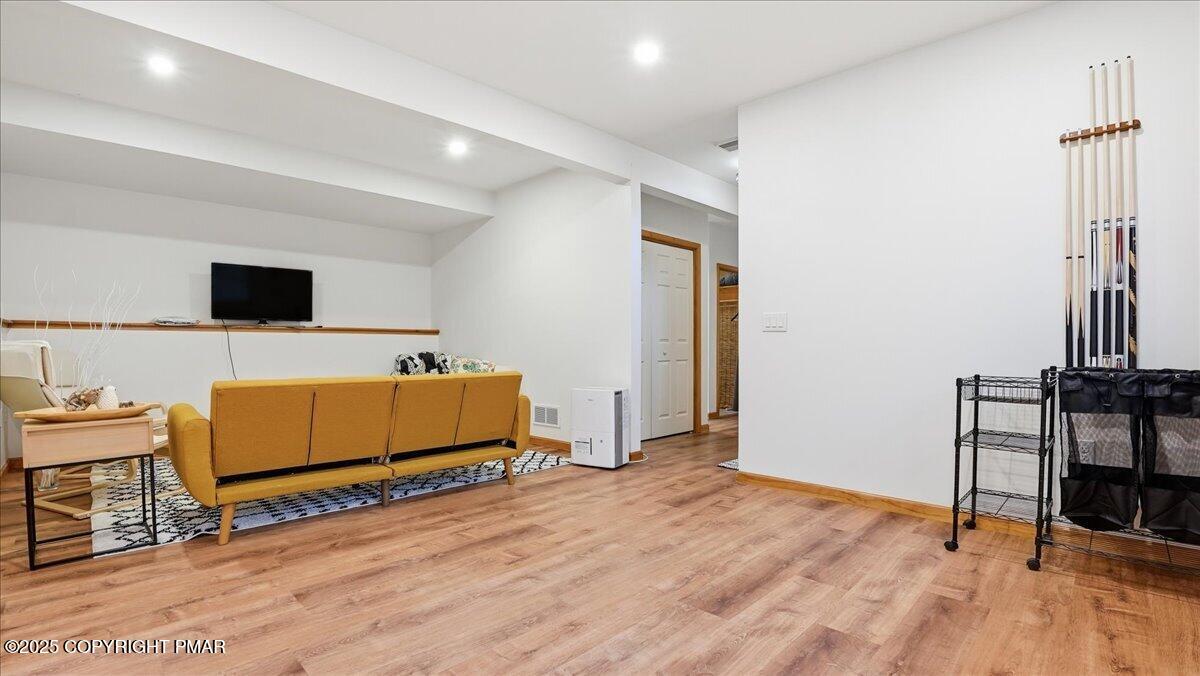 163 Long Woods Road Tobyhanna, PA 18466 - Photo 26 of 52 a bedroom with furniture and a flat screen tv