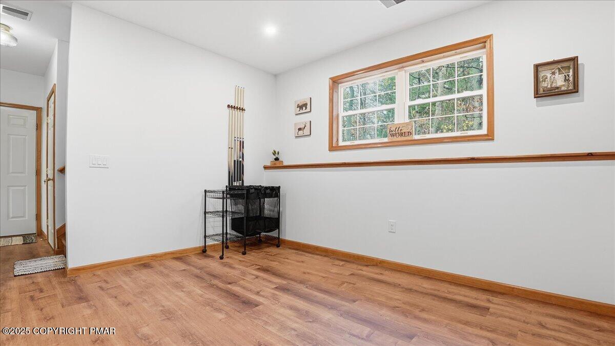 163 Long Woods Road Tobyhanna, PA 18466 - Photo 29 of 52 a view of a room with a window and wooden floor