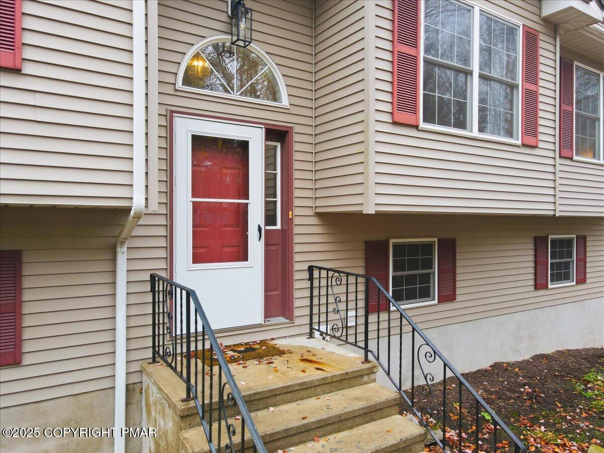163 Long Woods Road Tobyhanna, PA 18466 - Photo 3 of 52 a front view of a house with street