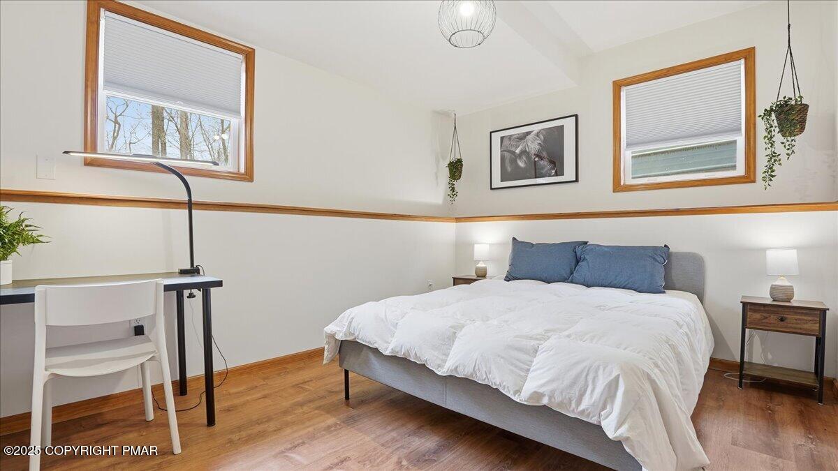 163 Long Woods Road Tobyhanna, PA 18466 - Photo 33 of 52 a bedroom with a bed and a desk