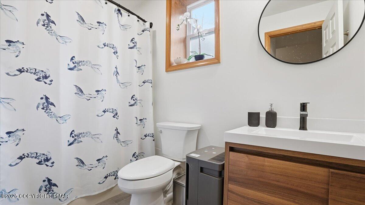 163 Long Woods Road Tobyhanna, PA 18466 - Photo 35 of 52 a bathroom with a sink and a mirror