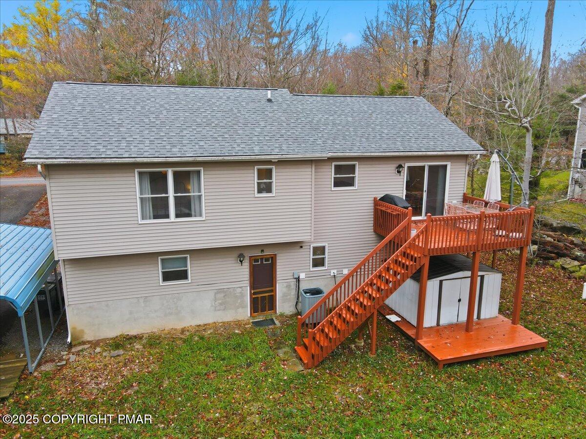 163 Long Woods Road Tobyhanna, PA 18466 - Photo 37 of 52 a aerial view of a house with table and chairs