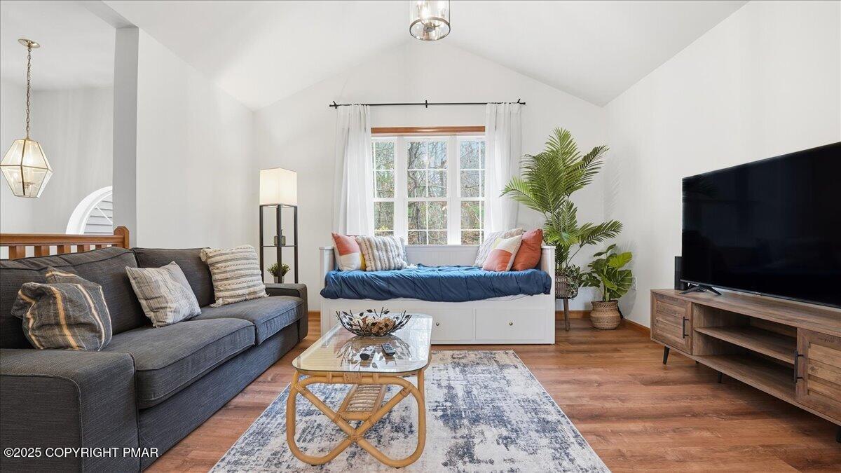 163 Long Woods Road Tobyhanna, PA 18466 - Photo 4 of 52 a living room with furniture and a flat screen tv