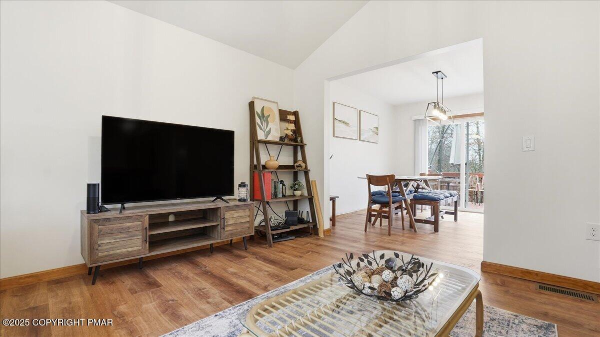 163 Long Woods Road Tobyhanna, PA 18466 - Photo 41 of 52 a living room with furniture and a flat screen tv