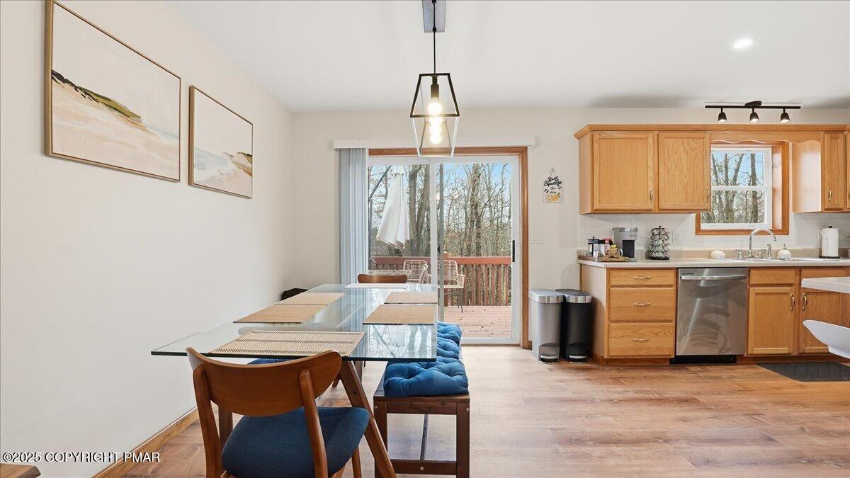 163 Long Woods Road Tobyhanna, PA 18466 - Photo 43 of 52 a very nice looking kitchen with granite countertop a stove a sink a window and dining table