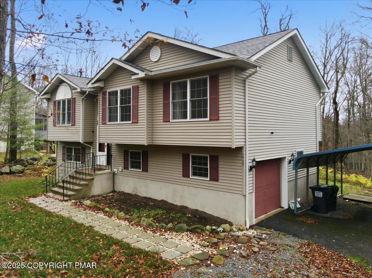163 Long Woods Road Tobyhanna, PA 18466 - Photo 46 of 52 a front view of a house with a yard